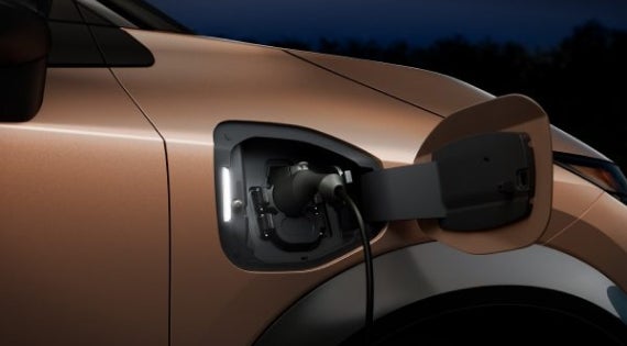Close-up image of charging cable plugged in | Gates Nissan of Richmond in Richmond KY